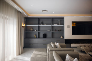 Design ideas for a large contemporary formal and grey and white open plan living room feature wall in Buckinghamshire with white walls, marble flooring, a standard fireplace, a timber clad chimney breast, a built-in media unit and white floors.