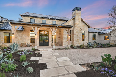Inspiration for a large rustic house exterior remodel in Austin