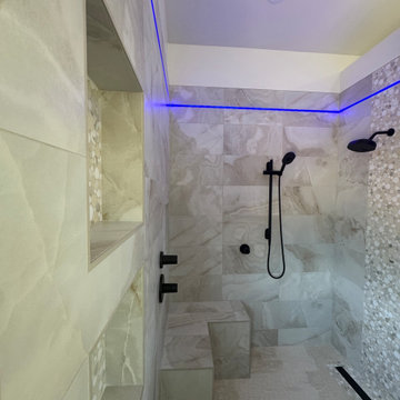 Curd-less walk-in shower; heated floors in bathroom + shower+bench LED