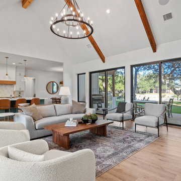 Modern Lakeside Farmhouse Living Room with Vaulted Ceilings and Natural Light