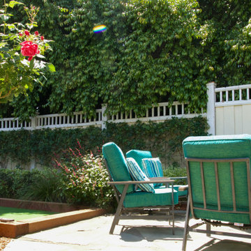 Garden Seating Against a Lush Privacy Hedge