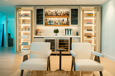 Inspiration for a large modern home bar remodel in Miami
