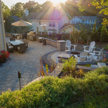 Dual patio with adjoining firepit feature