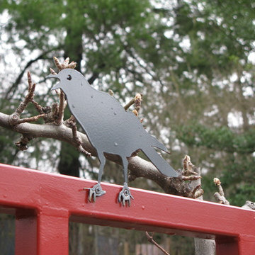 Pear espalier and crow cutout atop custom trellis