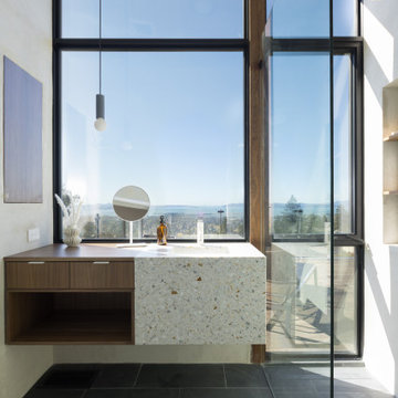 Primary bathroom with terrazzo waterfall vanity - Fold House Berkeley Hills