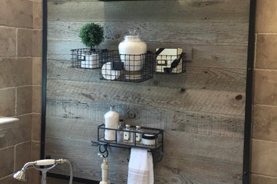 Inspiration for a mid-sized farmhouse master beige tile and stone tile dark wood floor bathroom remodel in Orange County with distressed cabinets, beige walls and granite countertops