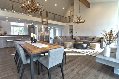 Large trendy formal and open concept light wood floor and brown floor living room photo in Seattle with white walls, no fireplace and no tv