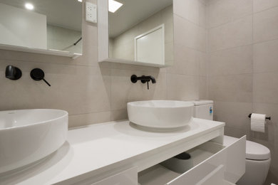 Large contemporary bathroom with flat-panel cabinets, white cabinets, an open shower, beige tile, ceramic tile, beige walls, cement tiles, engineered quartz benchtops, brown floor, an open shower, white benchtops, a double vanity and coffered.