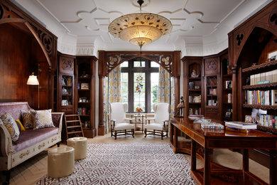 Large elegant freestanding desk light wood floor study room photo in Miami