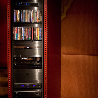 Inspiration for a large mediterranean enclosed home cinema in Los Angeles with orange walls, carpet and a projector screen.