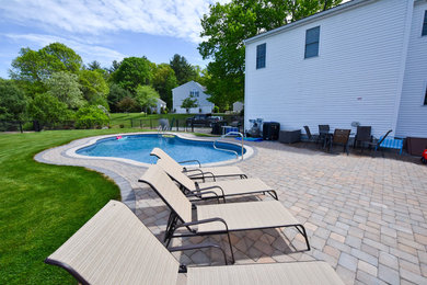 Example of a trendy brick patio design in Boston