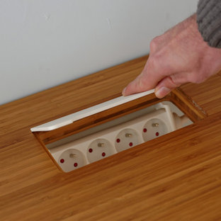 This is an example of a medium sized modern home office and library in Brussels.