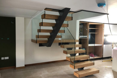Oak tread stair with frameless glass