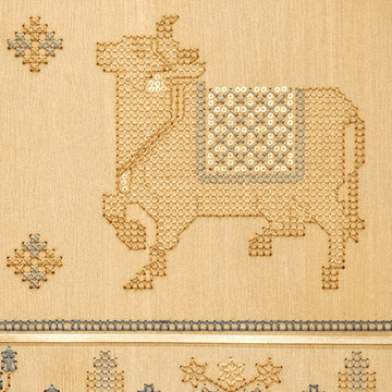 Close-up of stitched veneer revealing texture: Embroidered Veneer wardrobe