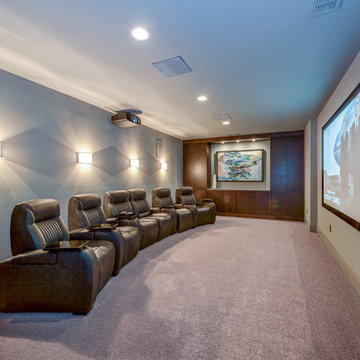 Home Theater with custom cabinetry (carpet color is actually taupe-grey)