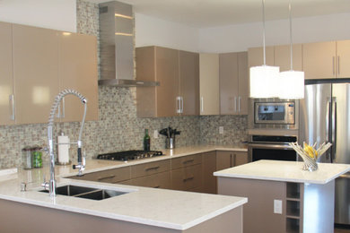 Inspiration for a mid-sized modern u-shaped dark wood floor and brown floor eat-in kitchen remodel in San Diego with a double-bowl sink, flat-panel cabinets, beige cabinets, quartzite countertops, multicolored backsplash, mosaic tile backsplash, stainless steel appliances and an island