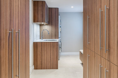 This is an example of a contemporary laundry room in Ottawa.
