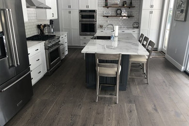 This is an example of a traditional kitchen in Seattle with porcelain floors and grey floor.