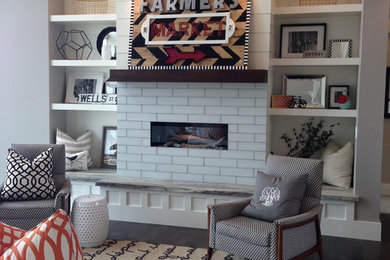 Inspiration for a huge contemporary open concept family room remodel in Phoenix with gray walls, a standard fireplace and a media wall