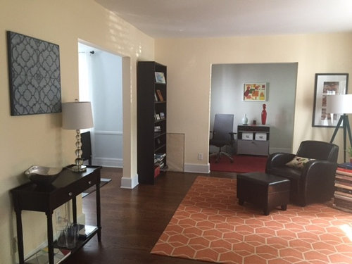 Living Room With Door In Middle And Two Additional Openings Help