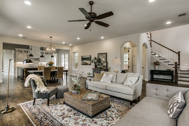 Family room - mid-sized traditional open concept dark wood floor family room idea in Dallas with white walls