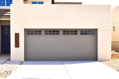 Inspiration for a mid-sized timeless attached two-car garage remodel in Austin