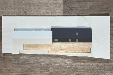 Photo of a contemporary house exterior in Other with mixed cladding.