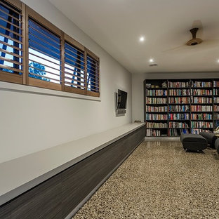 Inspiration for a modern concrete floor home theater remodel in Geelong with a wall-mounted tv