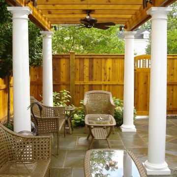 Wood Pergola with White Columns, Ceiling Fans and Flagstone Patio