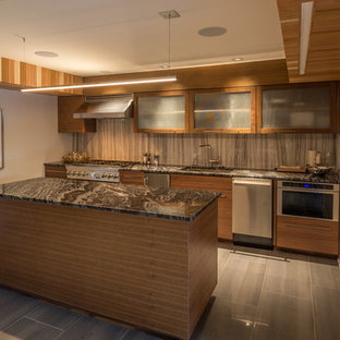 Expansive midcentury walk-out basement in Omaha with grey walls, porcelain flooring, a standard fireplace, a tiled fireplace surround and grey floors.