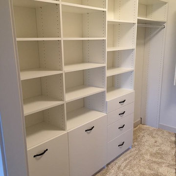 Master Closet - white finish with drawers, shelves and clothes hampers