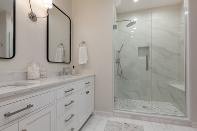 Large minimalist marble floor, gray floor and double-sink bathroom photo in Chicago with beige cabinets, beige walls, an undermount sink, quartz countertops, a hinged shower door, beige countertops and a freestanding vanity