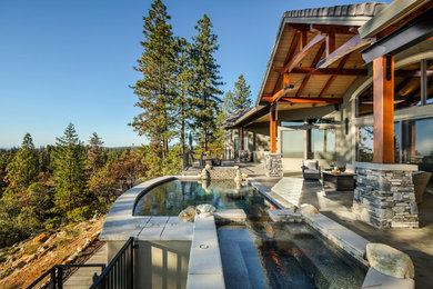 Example of a mid-sized arts and crafts backyard tile outdoor patio shower design with a roof extension