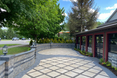 Imagen de jardín de secano minimalista grande en patio con exposición total al sol y adoquines de ladrillo