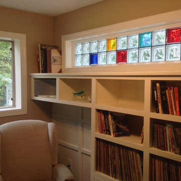 Operable slider window and colored glass block transom allow light and style Col