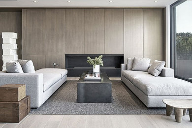Example of a large trendy formal and enclosed light wood floor and beige floor living room design in San Francisco with a ribbon fireplace, a wood fireplace surround and no tv