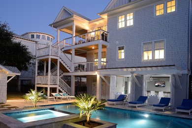 Inspiration for a large timeless backyard concrete paver and rectangular pool remodel in Charleston
