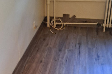 Bedroom - small craftsman guest laminate floor and gray floor bedroom idea in Philadelphia with beige walls