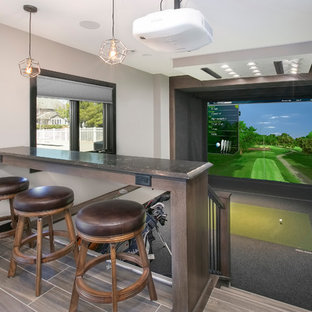 Design ideas for a medium sized traditional walk-out basement in Minneapolis with grey walls, porcelain flooring, no fireplace and brown floors.