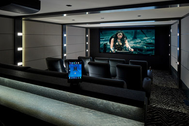 Example of a cottage chic home theater design in New York
