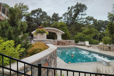 Pool - mid-sized traditional backyard concrete and rectangular lap pool idea in Minneapolis