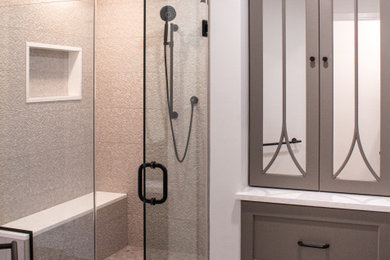 Inspiration for a mid-sized master gray floor and double-sink bathroom remodel in Boston with flat-panel cabinets, gray cabinets, a one-piece toilet, white walls, a drop-in sink, quartzite countertops, a hinged shower door, white countertops and a built-in vanity