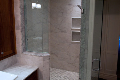 Large minimalist master black and white tile and stone tile corner shower photo in Toronto with shaker cabinets