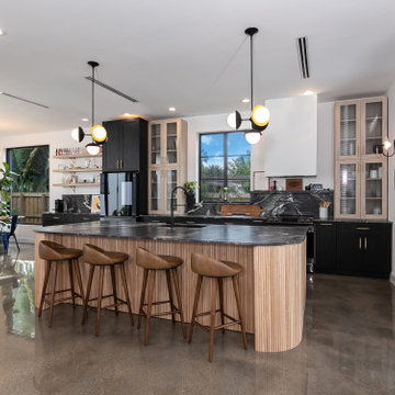 Elegant Kitchen with Statement Lighting and Black Island in Wilton Manors, Flori