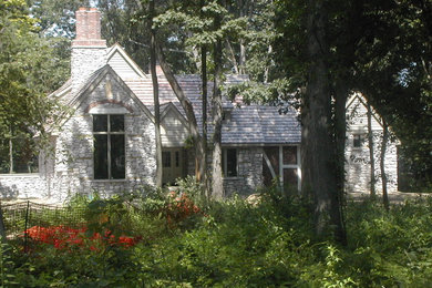 Inspiration for a mid-sized timeless gray one-story stone exterior home remodel in Chicago with a shingle roof