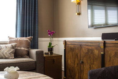 Family room - mid-sized transitional open concept medium tone wood floor and brown floor family room idea in Chicago with a wall-mounted tv and brown walls