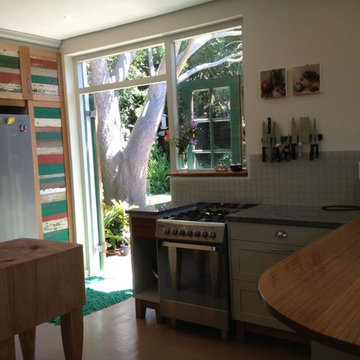 butcher block, granite and bamboo countertops with recycled cupboard doors