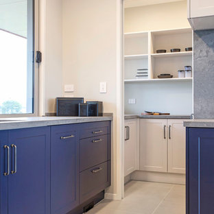 Large country kitchen pantry in Other with a double-bowl sink, shaker cabinets, blue cabinets, quartz benchtops, grey splashback, stone slab splashback, stainless steel appliances, porcelain floors, grey floor and grey benchtop.
