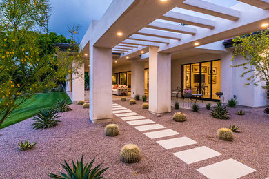 Inspiration for a large contemporary beige one-story stucco exterior home remodel in San Diego