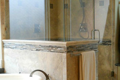 Inspiration for a large mediterranean master beige tile and mosaic tile travertine floor bathroom remodel in Dallas with furniture-like cabinets, dark wood cabinets, granite countertops and beige walls